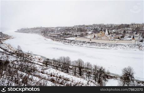 View of the frozen Volga River and the ancient russian town Staritsa with the Holy Assumption Monastery on riverbank