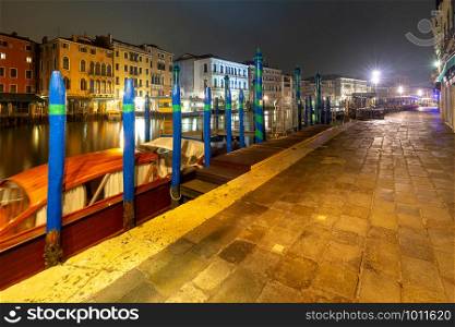 View of the Grand Canal and the city in the night light at sunset. Venice. Italy.. Venice. Grand Canal at sunset.