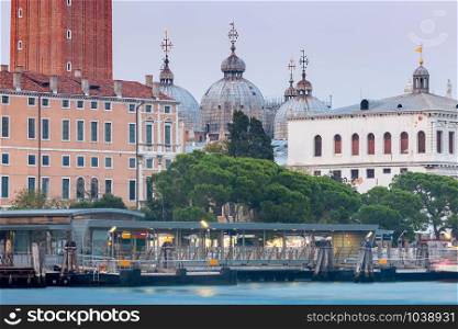 View of the Grand Canal and the city promenade at sunset. Venice. Italy.. Venice. Grand Canal at sunset.