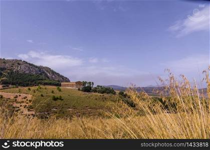 View of the greek temple of segesta and its surroundings in italy sicily