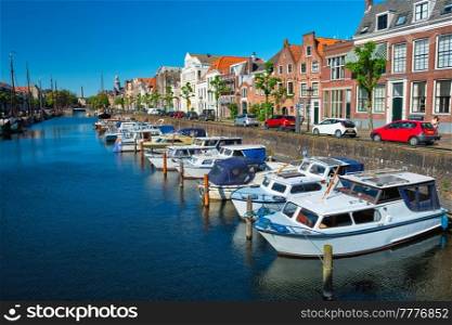 View of the harbour with moored boats in Delfshaven district. Rotterdam, Netherlands. View of the harbour of Delfshaven. Rotterdam, Netherlands