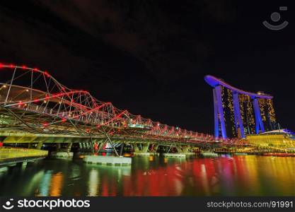 view of the Helix Bridge at night, urban landscape of Singapore