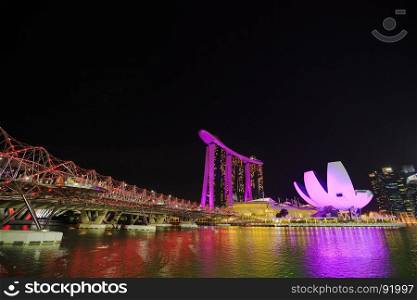 view of the Helix Bridge at night, urban landscape of Singapore