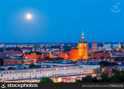 View of the historic center of Gdansk and the Church of St. Catherine at night.. Gdansk. Catholic church of St. Catherine at night.