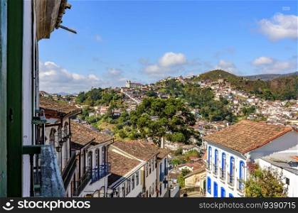 View of the historic city of Ouro Preto with its churches, hills and old colonial-style houses in the state of Minas Gerais. View of the city of Ouro Preto with its churches, hills and houses