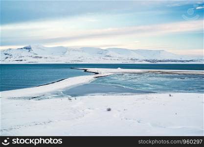 View of the Hvalfjordur in winter with the mountains covered by snow, Iceland. View of the Hvalfjordur in winter, Iceland