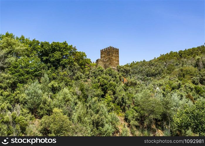 View of the keep tower of the medieval 11th century Castle of Lousa or Arouce, located in a deep valley of the Lousa Mountain Range near Coimbra, Central Portugal