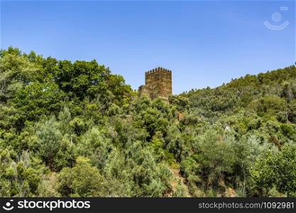 View of the keep tower of the medieval 11th century Castle of Lousa or Arouce, located in a deep valley of the Lousa Mountain Range near Coimbra, Central Portugal