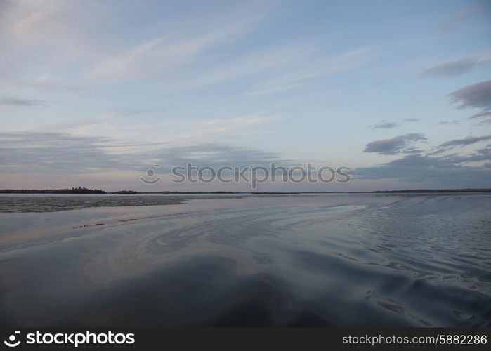 View of the lake surface at dusk, Lake Of The Woods, Ontario, Canada