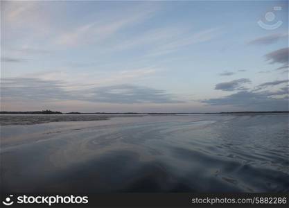View of the lake surface at dusk, Lake Of The Woods, Ontario, Canada