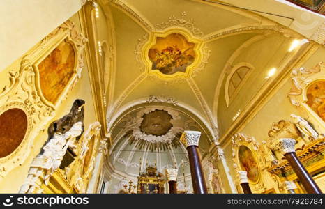 View of the lavish Baroque decorated apse and transept of the Basilica of Saint Apollinare Nuovo in Ravenna, Italy