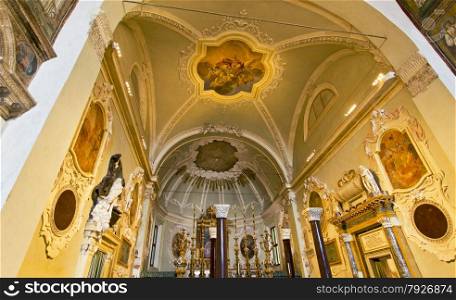 View of the lavish Baroque decorated apse and transept of the Basilica of Saint Apollinare Nuovo in Ravenna, Italy