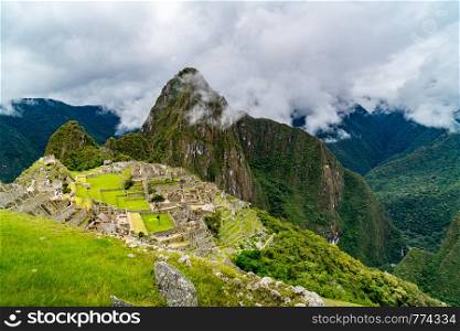 View of the lost Incan city of Machu Picchu in rainy day