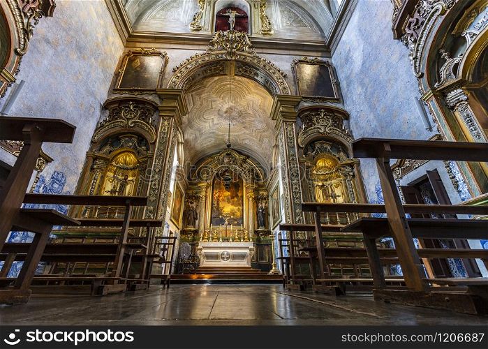 View of the magnificent Baroque interior of the Church of Sao Pedro de Alcantara, built in 1681 in guilt woodwork with Franciscan iconography, in Lisbon, Portugal