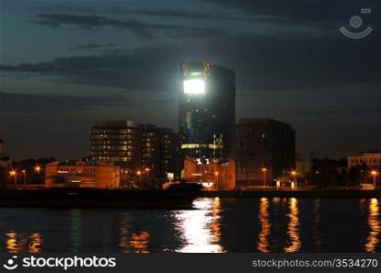 view of the Malookhtinsky embankment in St. Petersburg at night. night city