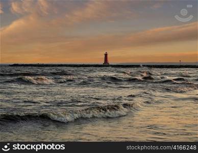 view of the Manistique lighthouse at sunset