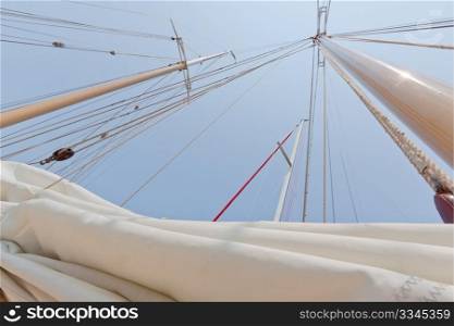 View of the mast and sail on the private sail yacht.