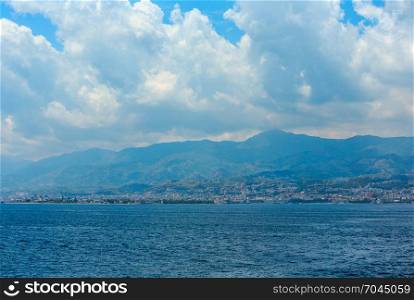 View of the Messina sea strait and coastline from the side of the ferry to Sicily island, Italy