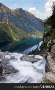 View of the mountain lake Morskie Oko from the top of the waterfall