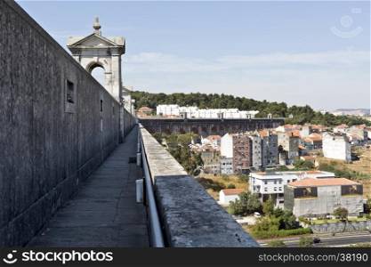 View of the north side of the top of the Aqueduct of the Free Waters looking away from the city of Lisbon, Portugal