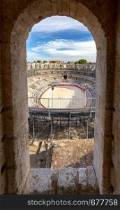 View of the old antique arena of the Roman amphitheater on a sunny day. Arles. France. Provence. France. Arles. Old antique roman amphitheater arena.