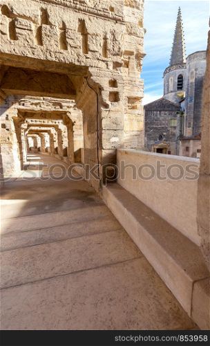 View of the old antique arena of the Roman amphitheater on a sunny day. Provence. France. Arles. Old antique roman amphitheater arena.