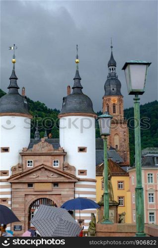 View of the Old Entrance to Heidelberg, Germany and the city Cathedral in the background.