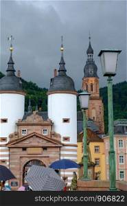 View of the Old Entrance to Heidelberg, Germany and the city Cathedral in the background.