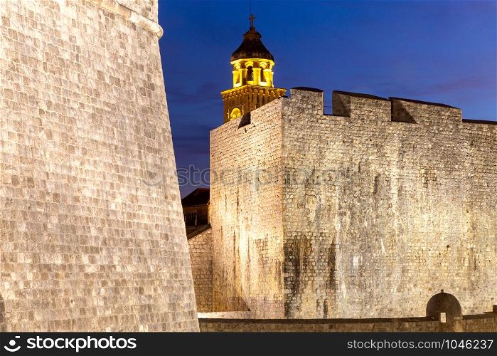 View of the old medieval walls and towers at sunset. Dubrovnik. Croatia.. Dubrovnik. Old walls and tower at dawn.
