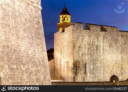 View of the old medieval walls and towers at sunset. Dubrovnik. Croatia.. Dubrovnik. Old walls and tower at dawn.