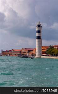 View of the old stone lighthouse on the island of Murano. Venice. Italy.. Old stone lighthouse on the island of Murano.
