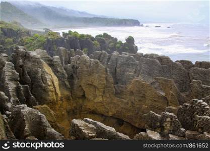 View of the Pancake Rocks in New Zealand with wide panorama on coast and sea