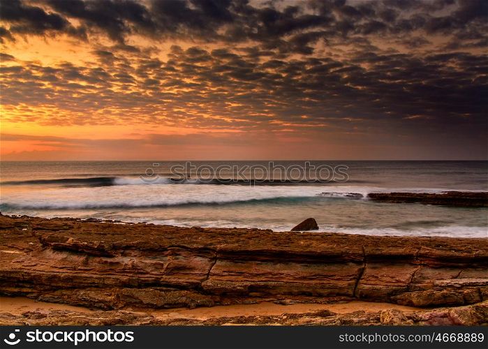 View of the Pedra Branca beach in Ericeira village, Portugal on late afternoon.