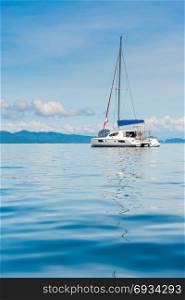 view of the pleasure yacht in the beautiful bay of Thailand, vertical photo