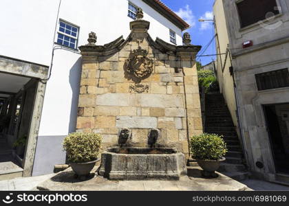 View of the public water fountain, Chafariz, built in Baroque architecture with two spouts and basin in Gouveia, Beira Alta, Portugal