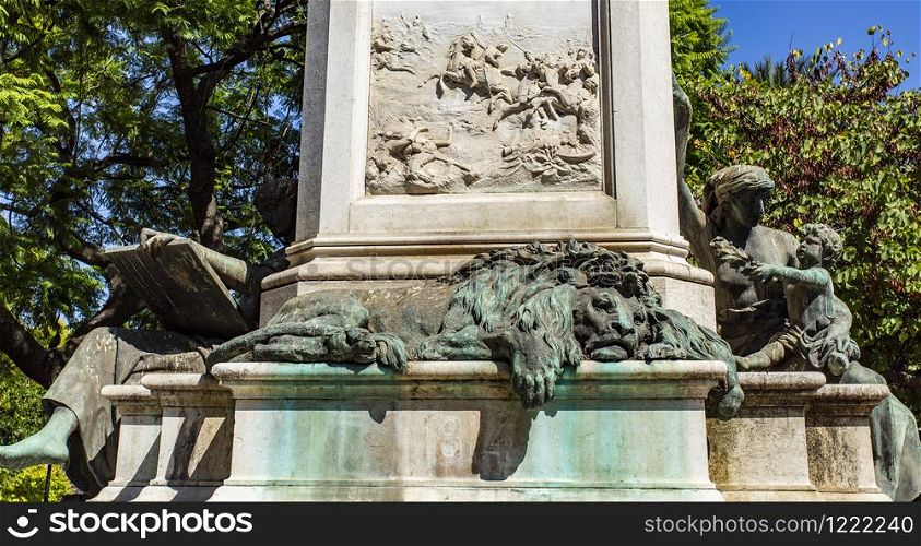 View of the relief depicting a battle during the Peninsular War and below a sleeping lion at the base of the bronze statue of Marquis de Sa da Bandeira, in Lisbon, Portugal