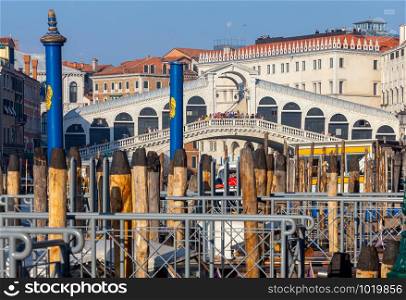 View of the Rialto Bridge and the Grand Canal on a sunny day. Venice. Italy.. Venice. Rialto Bridge on a sunny day.