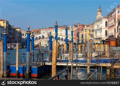 View of the Rialto Bridge and the Grand Canal on a sunny day. Venice. Italy.. Venice. Rialto Bridge on a sunny day.
