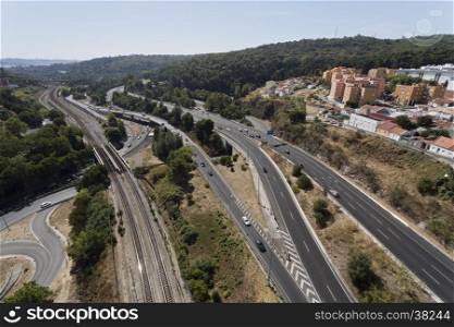 View of the road and railway infrastructure in the Alcantara Valley towards the south of the Aqueduct of the Free Waters in Lisbon, Portugal