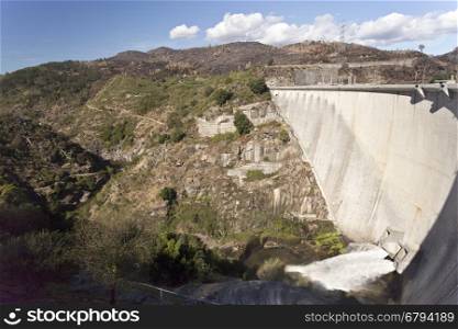View of the rock face and the Alto Lindoso Dam on the Lima River, Portugal