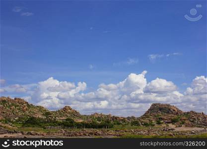 View of the rock mountains and clouds at Hampi, Karnataka, India. View of the rock mountains and clouds at Hampi, Karnataka, India.