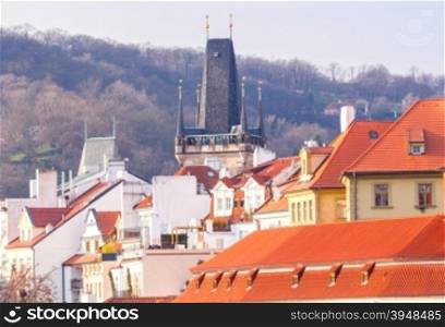 View of the roof and a tower of a small country in Prague.. Prague. Small country.