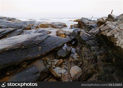 View of the rugged ocean rocky shore.. View of the rugged Atlantic rocky shore.