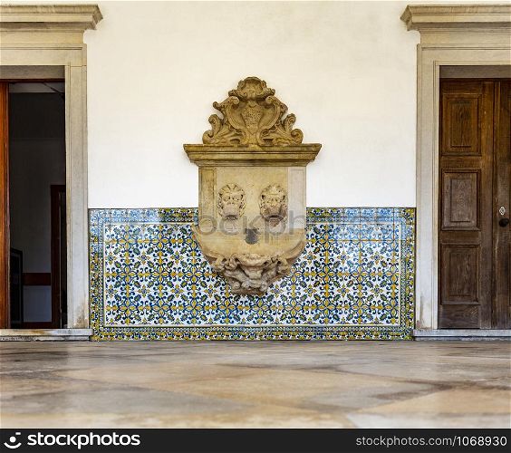 View of the ruined water fountain in the portico of the former Priests House of the Monastery of Saint Mary of Lorvao, Coimbra, Portugal