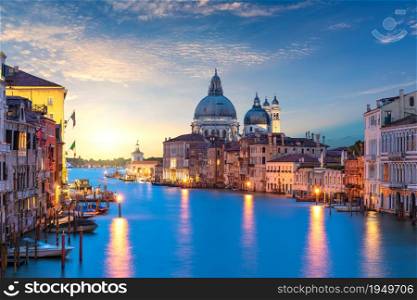 View of the Santa Maria della Salute dome in the Grand Canal at sunrise, Venice, Italy.