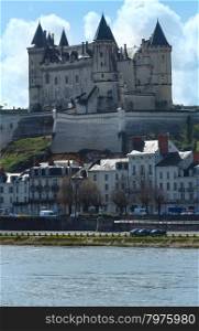 View of the Saumur castle from the other side of the river Loire, France. Constructed in the 10th century, was rebuilt in the later 12th century.