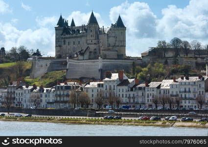 View of the Saumur castle from the other side of the river Loire, France. Constructed in the 10th century, was rebuilt in the later 12th century.