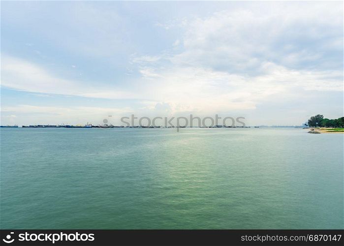 View of the sea from East Coast Park in Singapore under the beautiful blue sky with cloudy