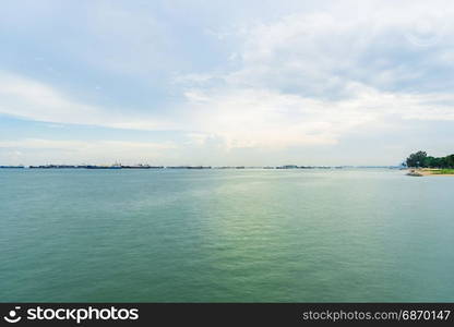 View of the sea from East Coast Park in Singapore under the beautiful blue sky with cloudy