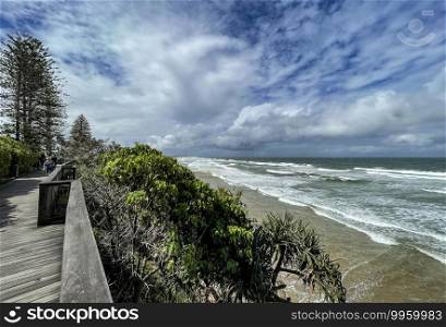 View of the short coastline board walk in Coolum Beach, one of the Sunshine Coast most spectacular headlands.